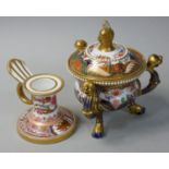 A Spode three-handled lidded urn, raised on trefoil feet, the finial and scroll handles formed as