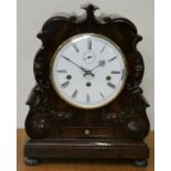 Comitti, a Regency style mahogany chiming mantle clock, the white enamel dial, signed, with