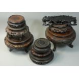A collection of nine Chinese hardwood stands, various sizes (9).