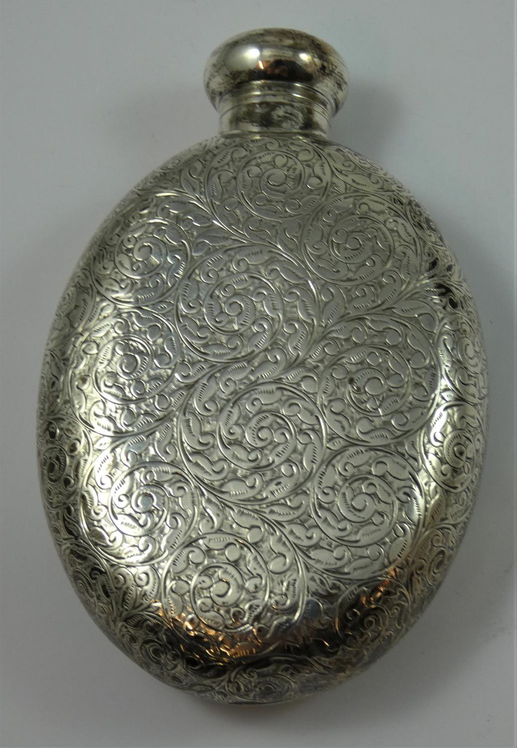 A Victorian silver hip flask, by M & L, Birmingham, 1896, of oval form with scroll engraved - Image 3 of 3