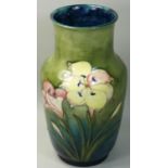 A William Moorcroft yellow lily pattern baluster vase, impressed marks, blue underglaze signature