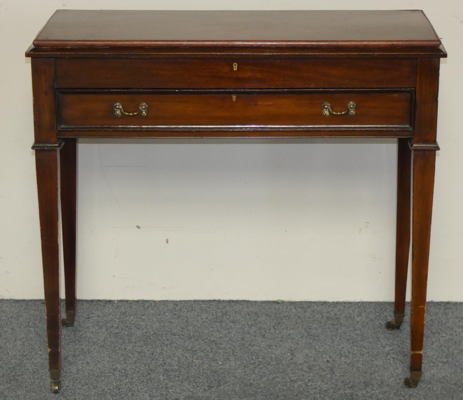 A part canteen of Old English pattern cutlery, contained with a mahogany side table with hinged