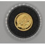 A 24ct gold coin 'The Giant Panda', issued in China, diameter 13.92mm, 1.6gms.
