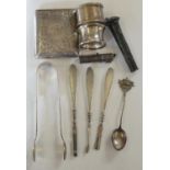 A silver cigarette case, Birmingham 1906, two silver napkin rings, a pair of sugar tongs, and
