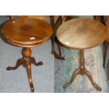 A mahogany tripod table and an oak tilt top table (2).