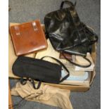 A collection of vintage ladies handbags, purses and belts.
