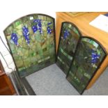 A three fold stained glass screen.