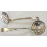 A George III silver sugar sifter spoon, London 1814, with engraved decoration and another with