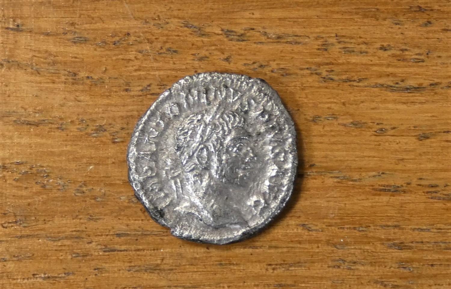 An Elagabalus (AD 218 - 222) coin and a piece of rock from Hadrians wall, mounted. - Image 2 of 2