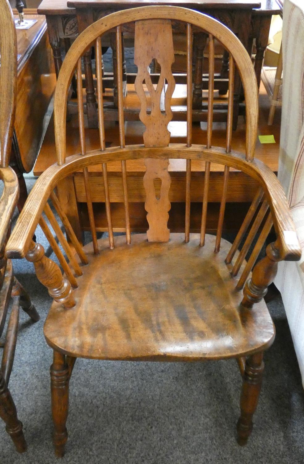 A Windsor lowback armchair saddle seat with figured grain pattern, 44cm seat height.