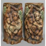 A pair of cylindrical vases with orangutan decoration, 'Sarawak 8789' incised to the bases, height