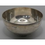 A silver sugar bowl, Sheffield 1916, with gadrooned border, 13.5 cm diam, weight 6 oz.