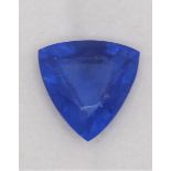 A heated treated and enhanced natural trillion shape sapphire, 9.85 cts, certificate.