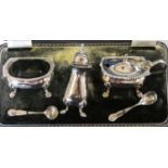 A silver three piece cruet, Birmingham 1961, with gadrooned borders, blue glass liners, 4.5 oz,