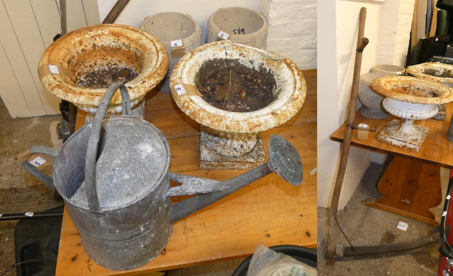 A pair of cast iron planters, galvanised watering can, scythe and a pair of concrete planters (6).