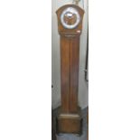 A Westminster chime oak cased manual wind granddaughter clock, 144cm tall.