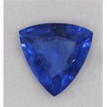 A heated treated and enhanced natural trillion shape sapphire, 9.25 cts, certificate.