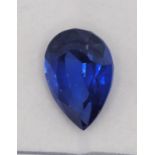 A heated treated and enhanced natural pear shape sapphire, 10.40 cts, certificate.