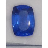 A heated treated and enhanced natural cushion shape sapphire, 10.65 cts, certificate.