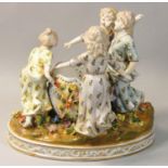 A Meissen style 20th century porcelain figure group, modelled as four girls dancing in a circle