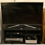 A Samsung curved 42 inch LCD television, together with a Panasonic Blu-Ray player, DVD combi player,