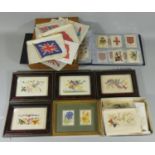 A collection of silk B.D.V. Cigarettes flags of the world housed in a wooden box,