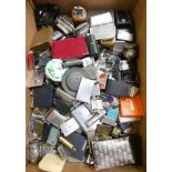 A large collection of cigarette lighters, various makers