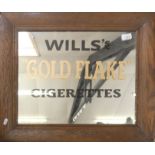 A rectangular oak framed mirror painted Wills Gold Flake Cigarettes, 52x62cm