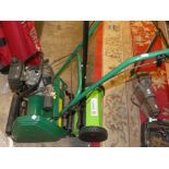 A Qualcast petrol cylinder mower Classic 35S with instruction manual and a 30cm hand mower
