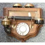 An Edwardian style wall mounted telephone with brass bells