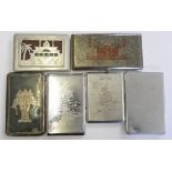 A WWII era alloy cigarette case with map of Africa, a palace, opening to reveal a saucy image, on