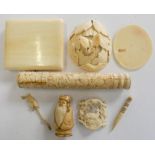 A Chinese carved ivory leaf with a butterfly, an ivory cigarette case, a carved antler brooch, a