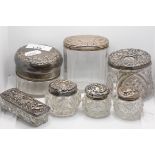 A silver mounted jar Birmingham 1909, with screw lid and five other silver lidded jars (6)
