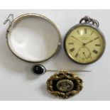 A silver pocket watch, silver bangle, a mourning brooch and a stickpin