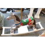 A painted wood carousel galloper rocking horse with brass pole, length 135cm