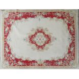 A cream background rug with red border, approx 375x265cm