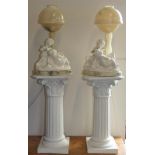 After Prof G. Bessi, a pair of carved alabaster table lamps each with a pair of cherubs, signed,