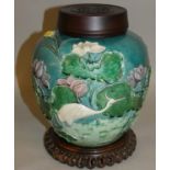 A Chinese turquoise glazed vase, with applied polychrome crane amongst foliage decoration, four