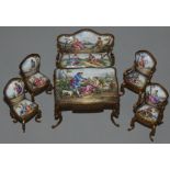 A Viennese suite of gilt metal and enamel dolls house furniture, 19th century, comprising: table,