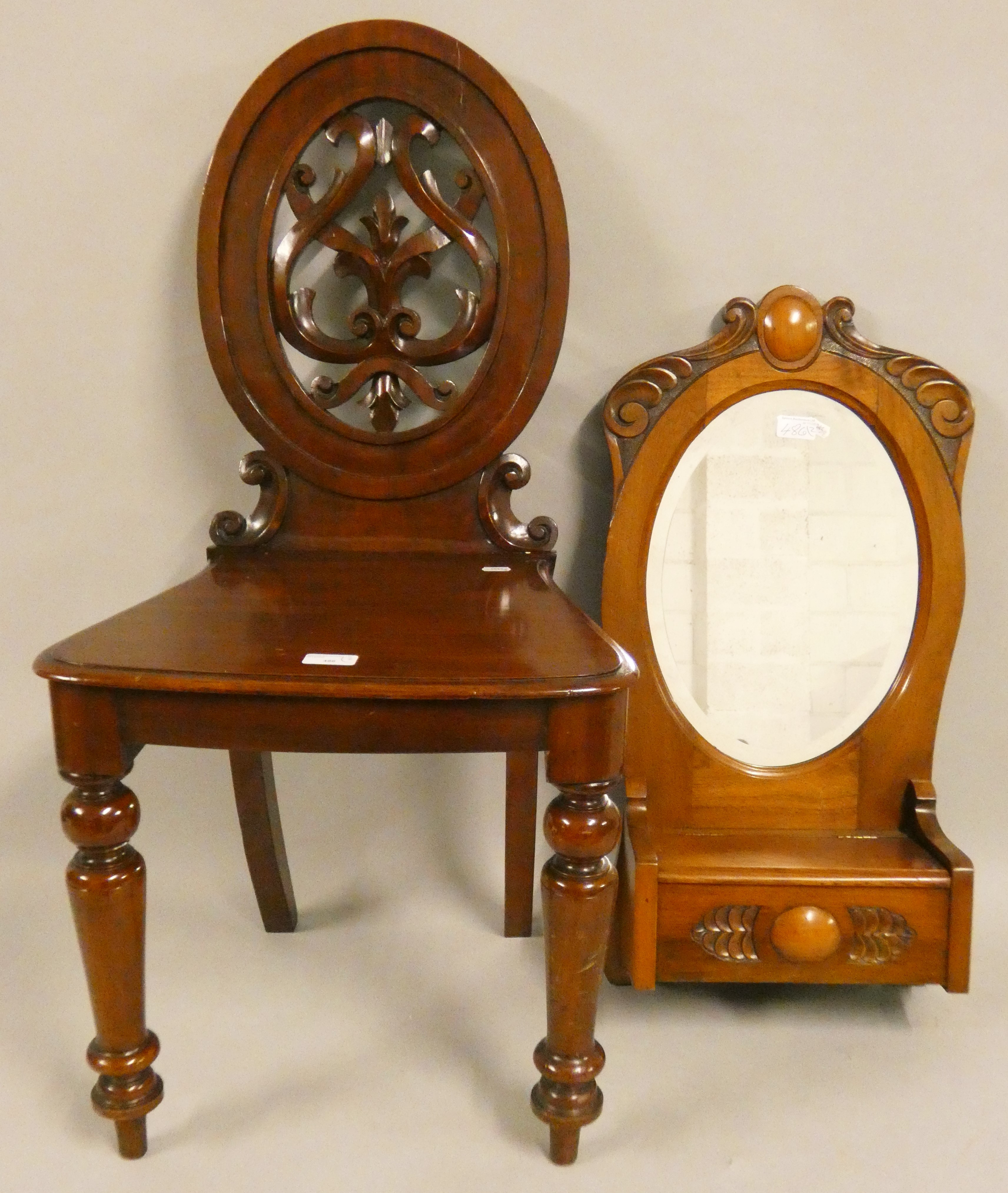 A Victorian mahogany hall chair, with carved and pierced back, together with a mahogany hall