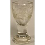 A Victorian Masonic firing glass, engraved with Masonic symbols on a bulbous foot, 14 cm