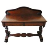A Victorian mahogany side table, the back rail with serpent terminals, two frieze drawers, lyre