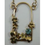 A 9ct gold and blue zircon pendant, in a floral mount, a similar bangle and pair of ear rings, gross