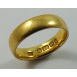 A 22 ct gold wedding band, 5 gms.