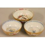 A pair of Chinese Qing dynasty porcelain bowls, with blue borders, the brown glaze exterior with