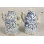 A pair of 19th century blue and white pottery ewers, height 13 cm.