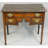 A 19th century oak lowboy, the rectangular top with a moulded edge, fitted with a single long and