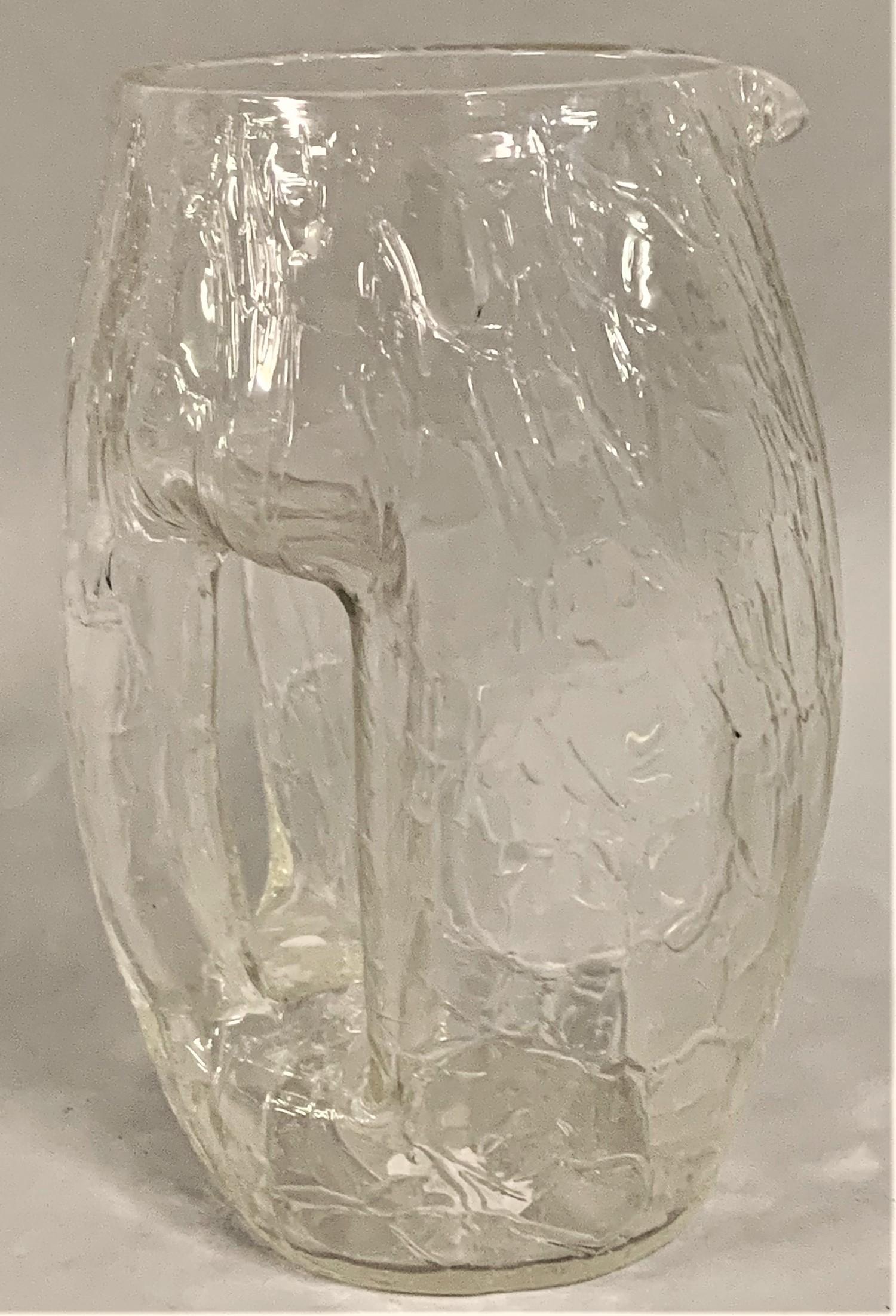 Attributed to Koloman Moser for Loetz: a clear crackle glass jug of barrel form, with integral