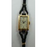 Asprey - an Art Deco 9ct gold ladies manual wind wristwatch, London 1935, the silvered dial with