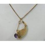 A Victorian gold mounted tigers claw and amethyst pendant, belcher link chain